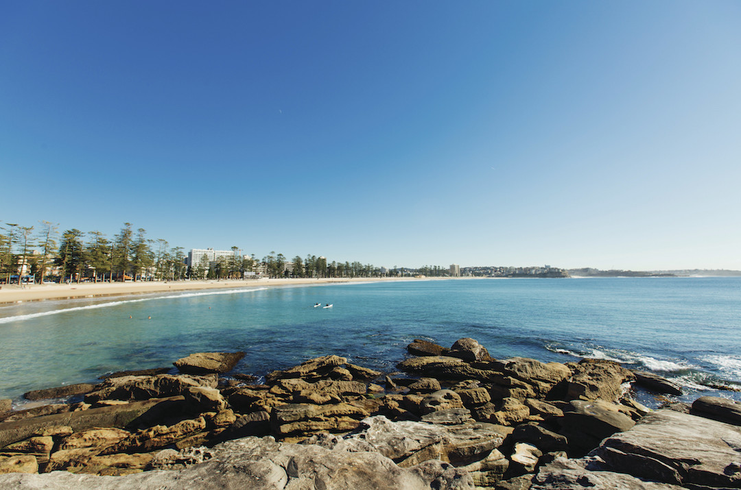 Kayakers enjoying a morning paddle at Manly Beach on Sydney's northern beaches.