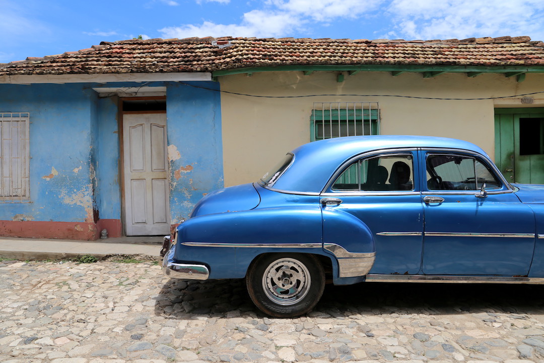 6. Intrepid Travel Beautiful Cuba tour car in the streets
